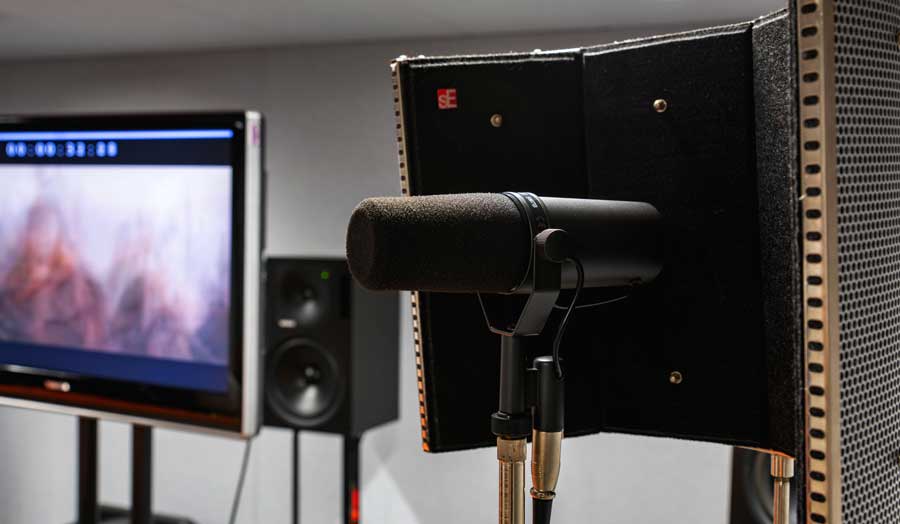 image of surround sound studio equipment: ADR in the forefront, a screen and speaker in the background 