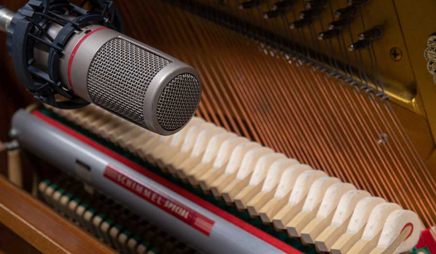 a close up image of a microphone recording 