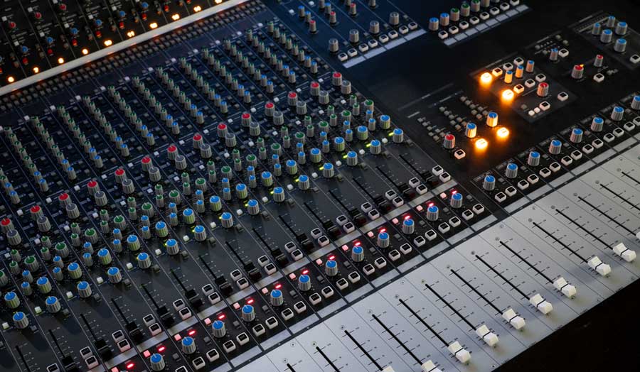 an image of an audient desk or mixing deck in a music control room
