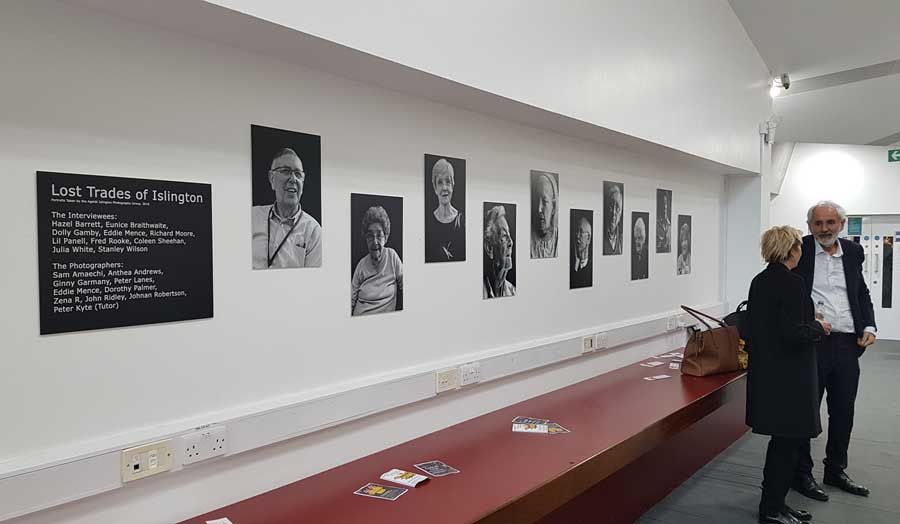 Photos of participants of Lost trades of Islington hanging of the wall for the launch event
