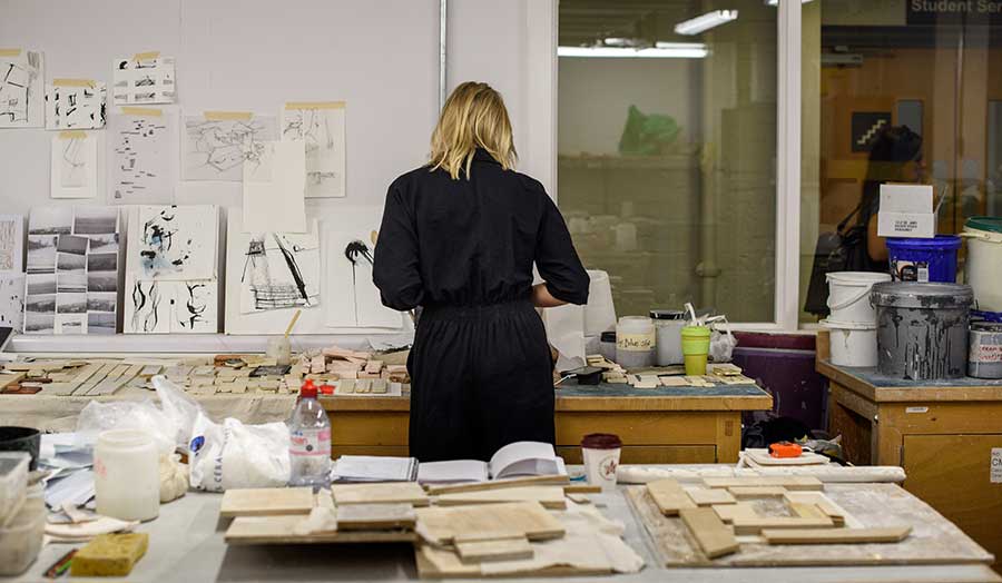 a student at work in the ceramics studio
