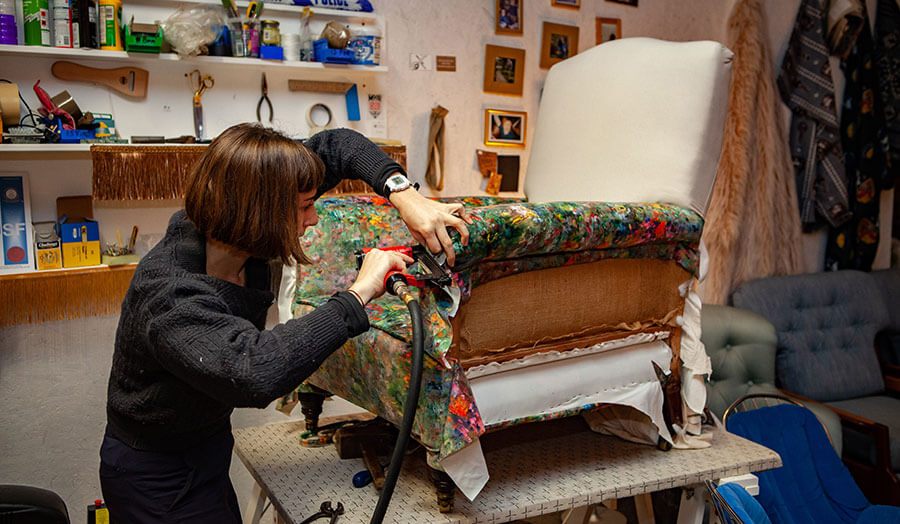 An image of Vanessa Butt working on a chair