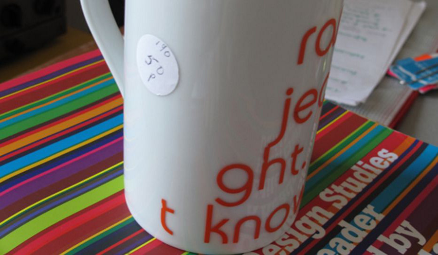 Photo of mug with typography on striped design book, Emma Davenport