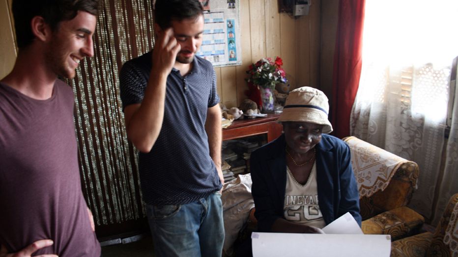 Presenting a resident with the surveys of the home Freetown