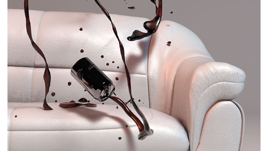 A can of ink or crude oil is being spilled dramatically on a plain white leather sofa 