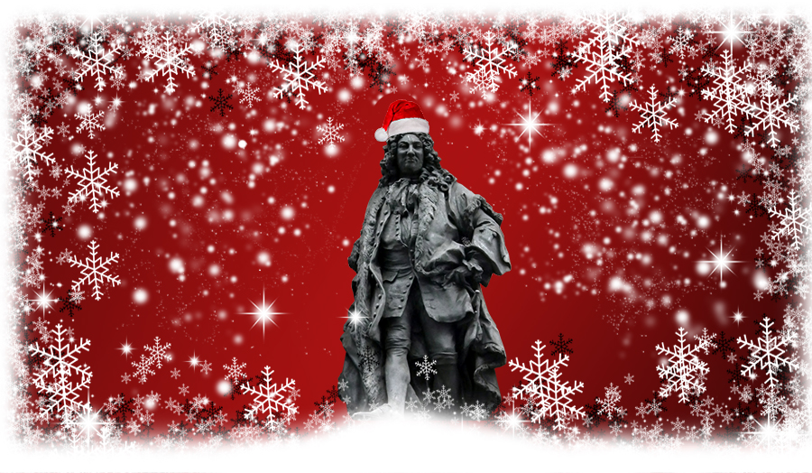 Image of a statue with a santa hat on his head and surrounded by snowflakes.
