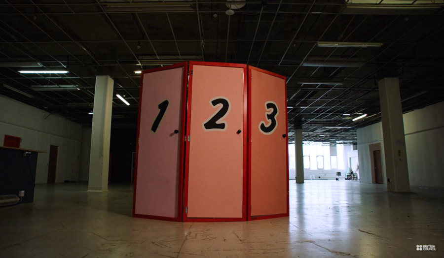 Three aligned doors with the numbers 1, 2 and 3 painted on them