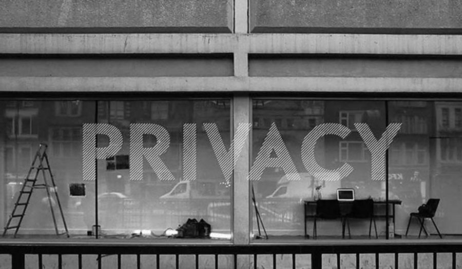 Image of the window to the gallery. The word "privacy" is on the window.