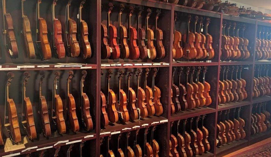 A shelf full of violins