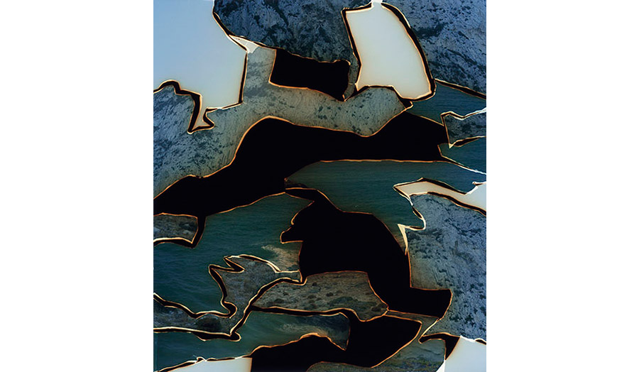 Fragments of bluish, green and black pieces put together like in a puzzle