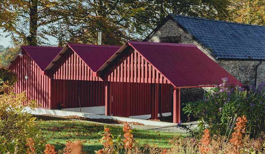 Row of red gabled sheds