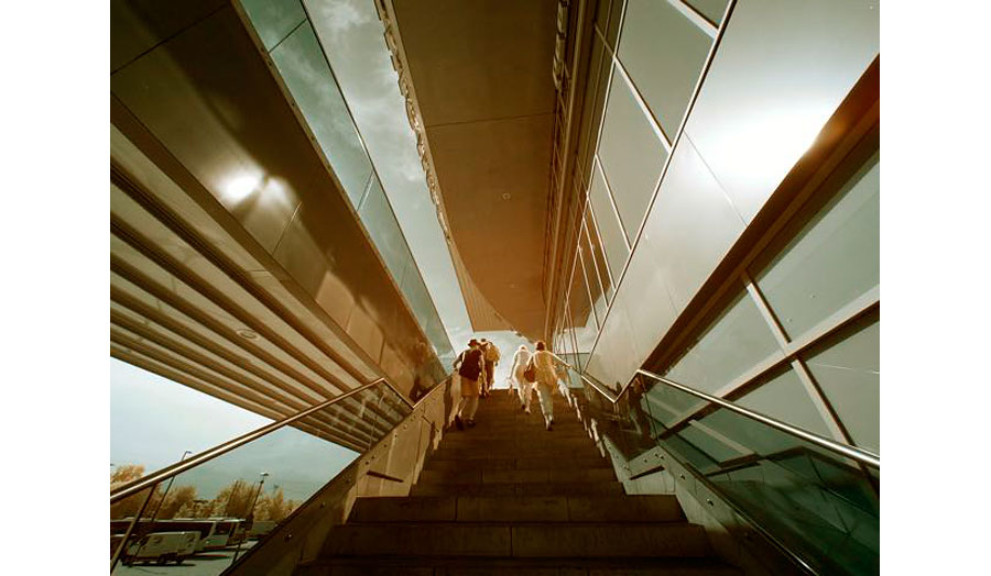 A photograph of people walking up a set of stairs.