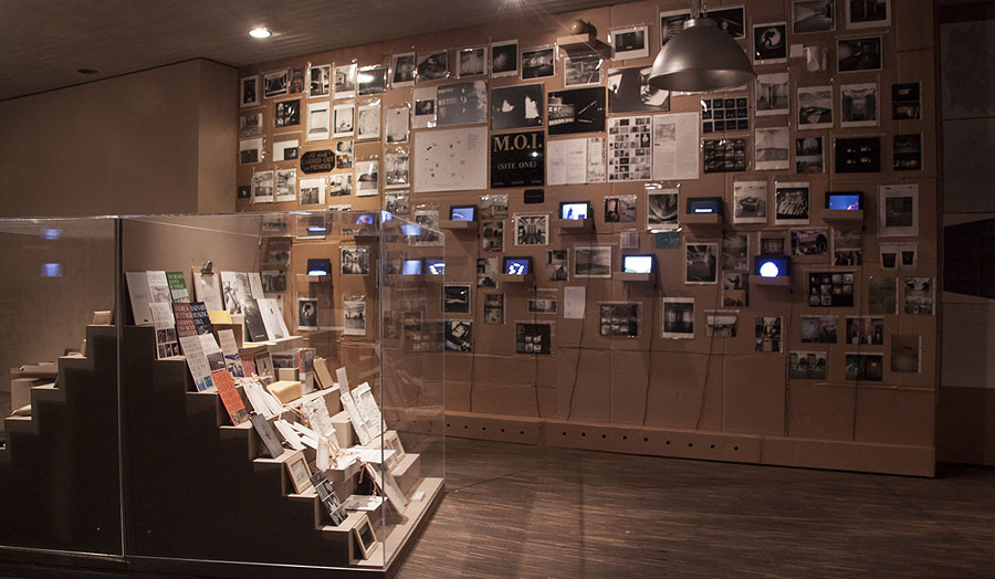 Image of room with display cases and art documents on the walls