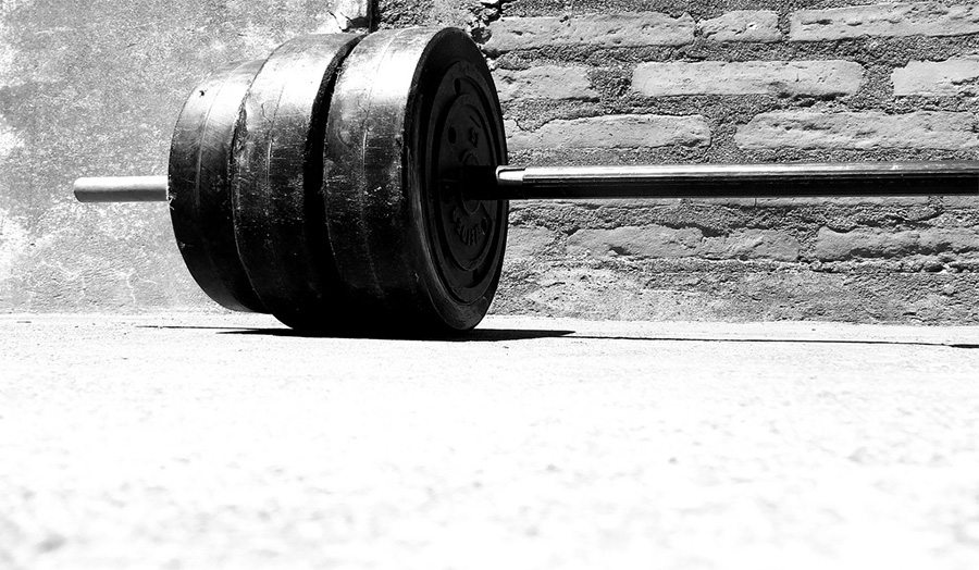 black-and-white photograph of the end of weights for lifting