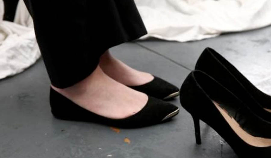 Photograph of Thorp’s flat shoes next to a pair of high heels, 16 May 2016