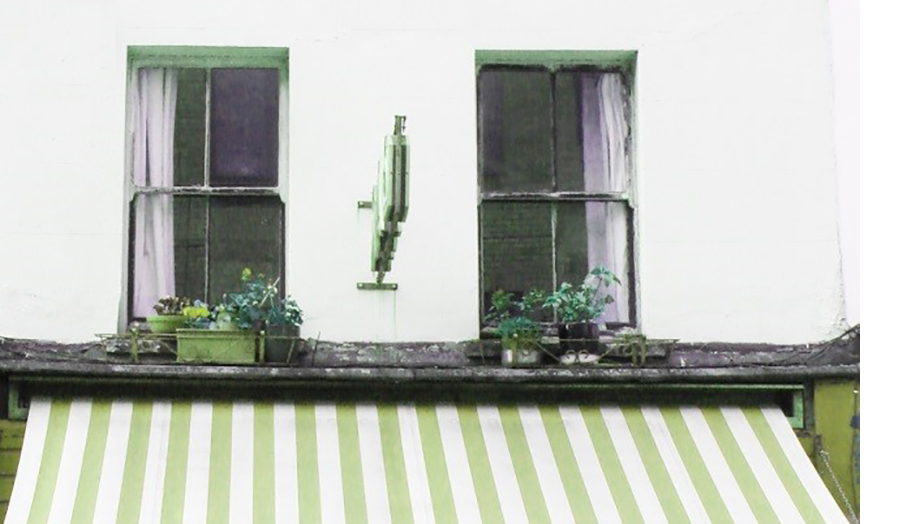 Photograph of two windows above shop hoarding in Lower Marsh Waterloo, taken by Kaye Newman.