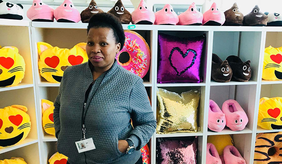 Fundiswa Mahola at her shop selling furry emojis, Cape Town airport