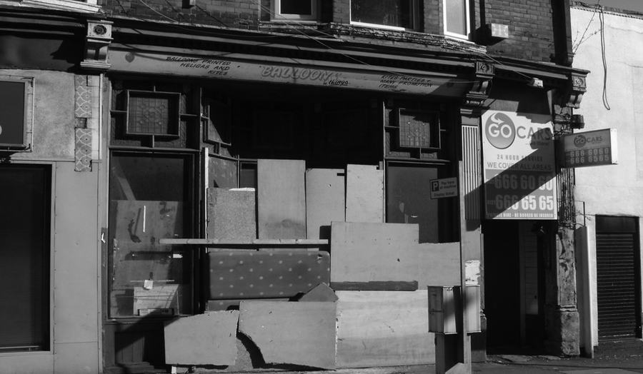 Boarded up shops on Essex Road