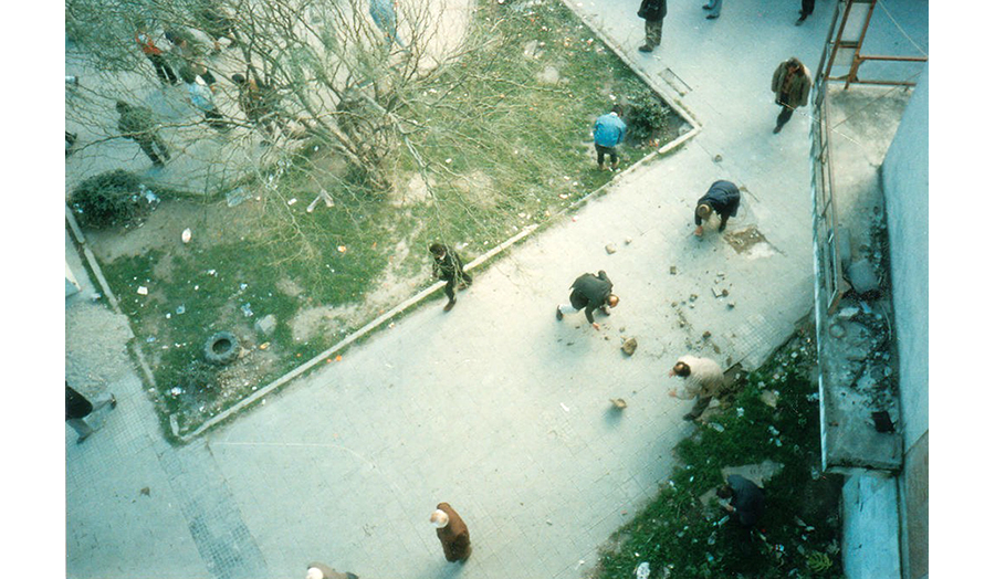 People break off stones from the pavement to use as ammunition. Photo: Robert Nagle, 1997 (CC BY-SA 2.0)