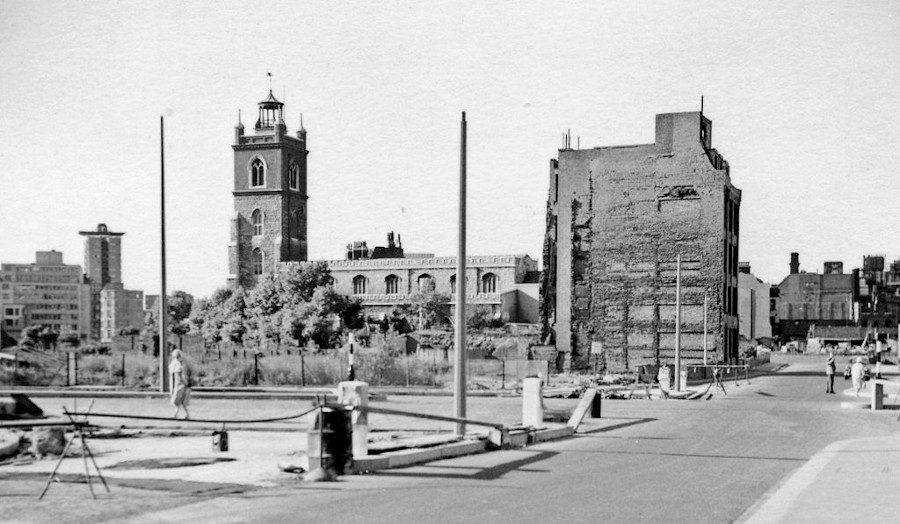 Post-war landscape with church and partially demolished building.