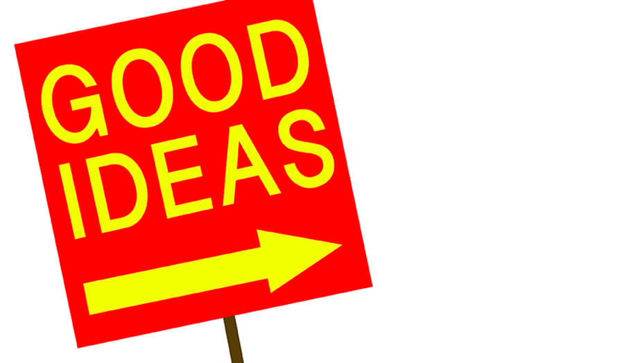red angled sign on a post with yellow text saying good ideas and an arrow pointing right 
