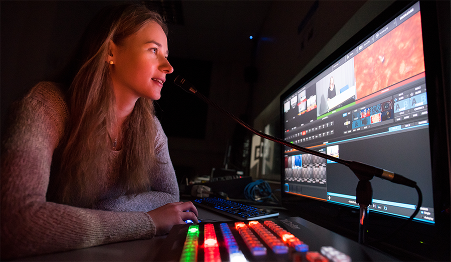 Female student using the TV studio's TriCaster