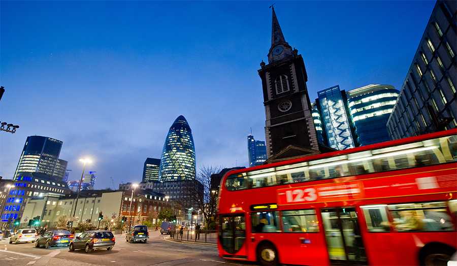A view of the Gherkin with a London bus in the foreground