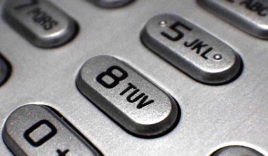 Close up of silver phone keypad