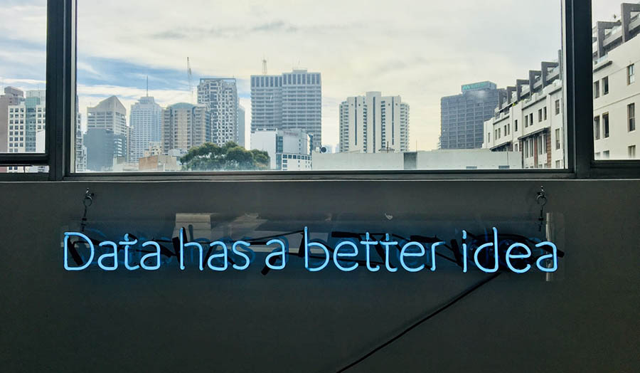 Neon sign on a wall saying 'Data Has a Better Idea'