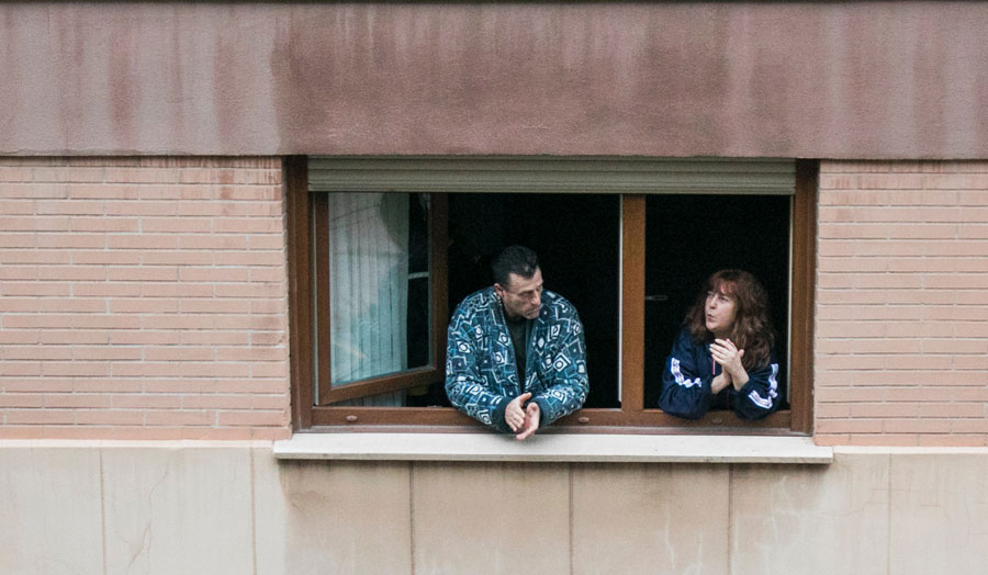two people at flat window