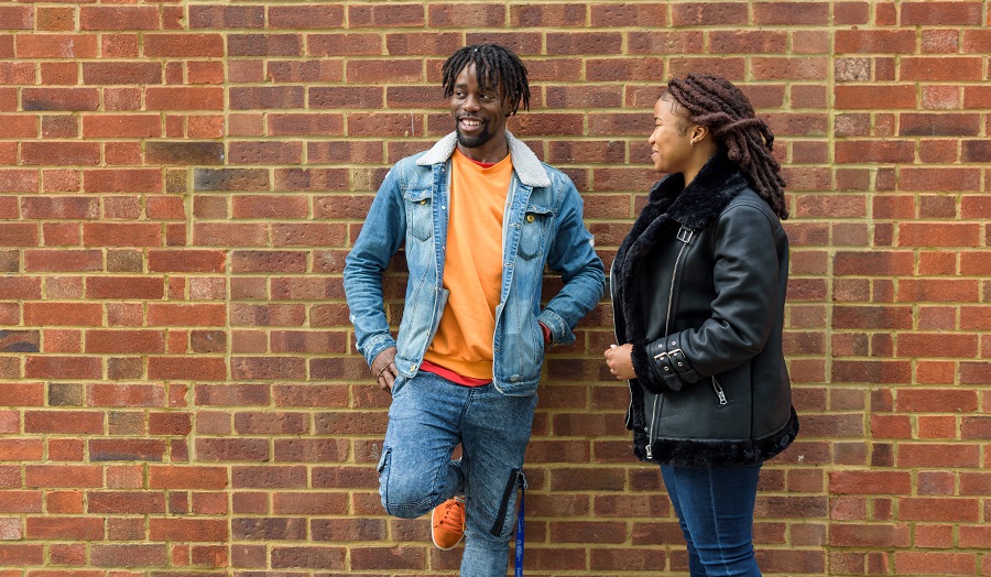 a male student and a female student standing outside London Metropolitan University