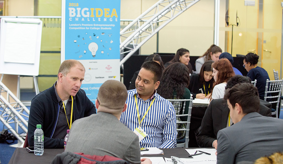 Students at a table discussing their ideas for the event