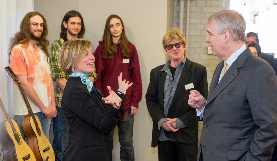 HRH The Duke of York speaks to Charlotte Gorse and musical instrument students. 