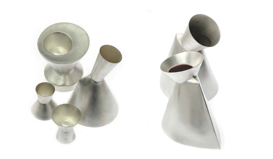 still life images of six abstract shaped silver vases and vessels 