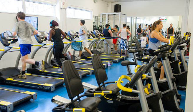 London Met gym members running on treadmills 