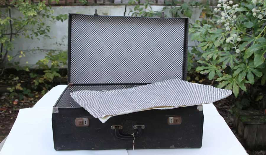 Suitcase with a false bottom used by London Recruit Tom Bell to smuggle illegal material into South 