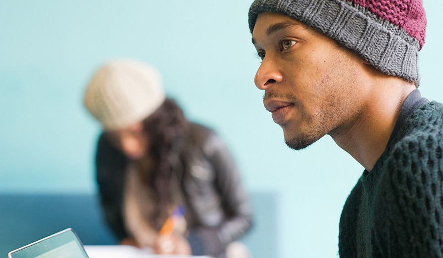 Black male student in hat