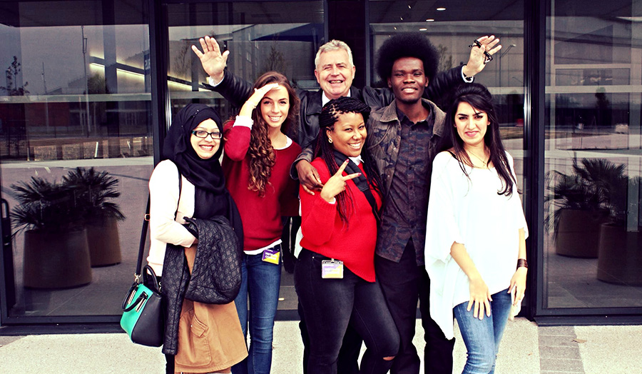 a group photo of female and male students on a Field Trip