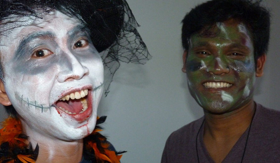 Students with painted faces at a Halloween Party