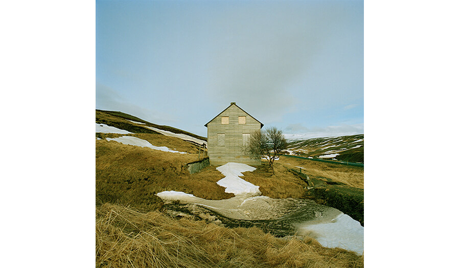Photograph of house in landscape from Undrawn Hours by Paola Leonardi