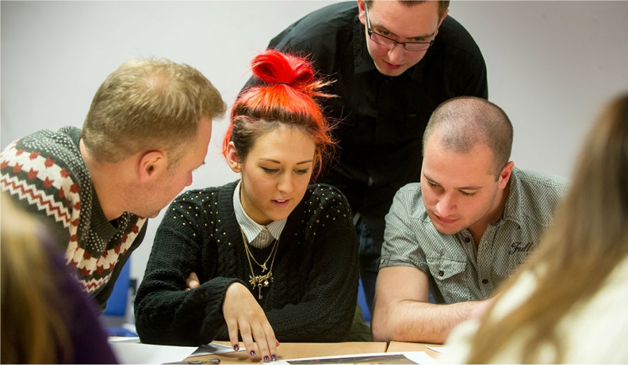 Students talking at a research meeting