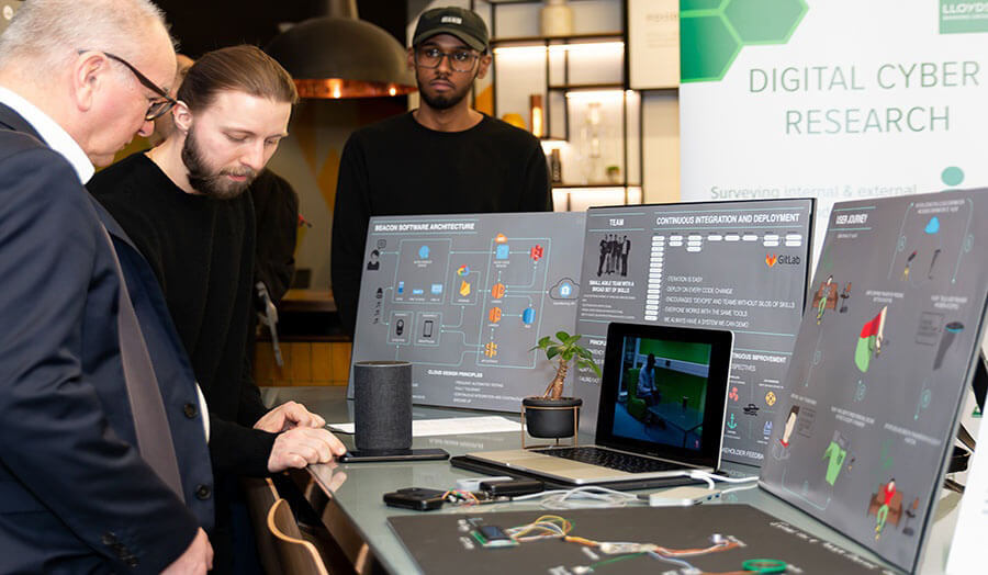 Students in the Cyber Security Research Centre working with industry professionals and academics