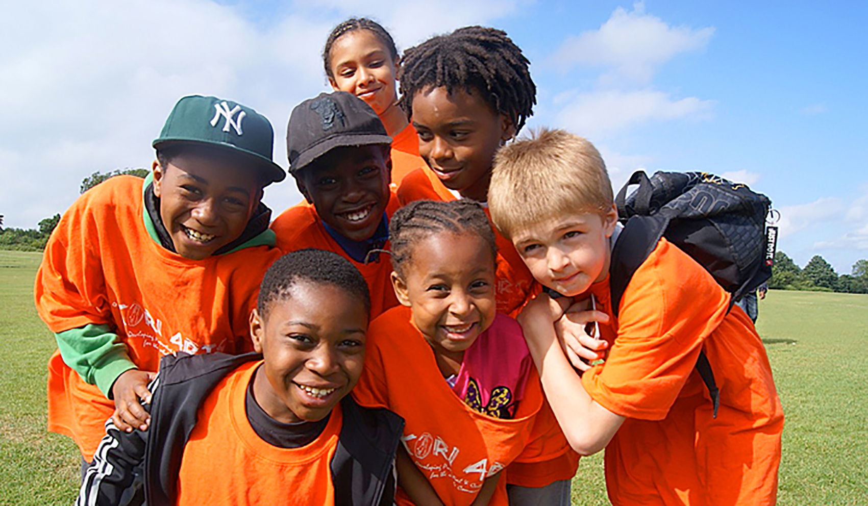 Children posing in KORI for Africa community charity t-shirts