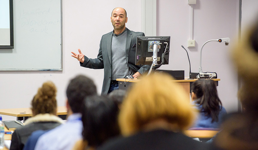 Craig Sharpe delivering a lecture. 