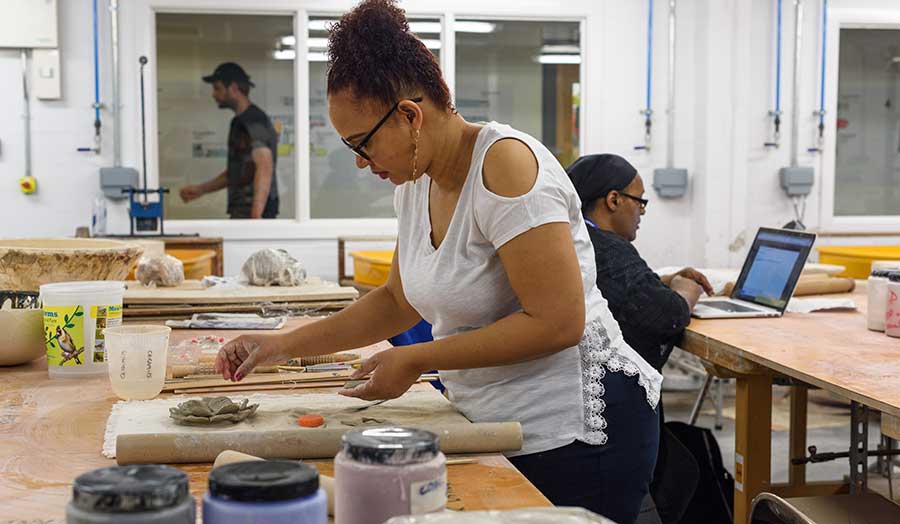 a student working in the ceramics studio