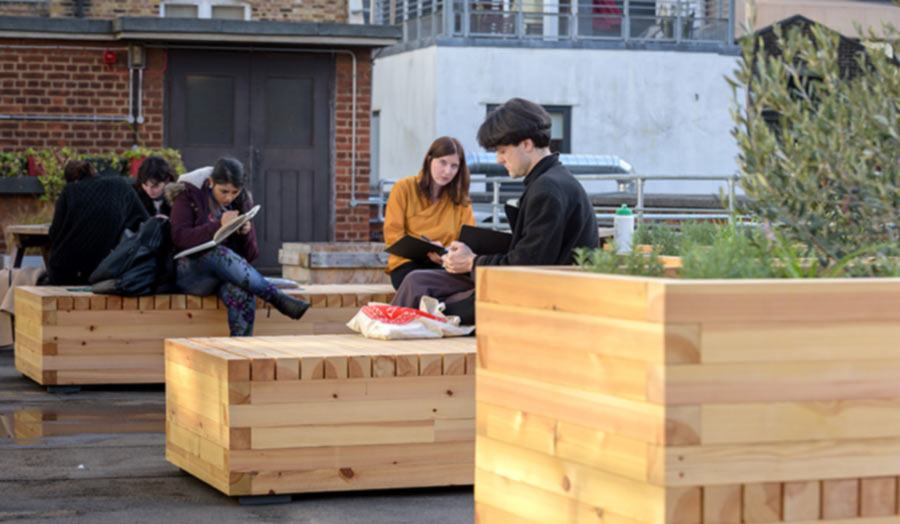 Seating and planters designed for rooftop communal area