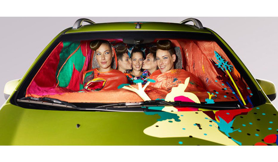 People in a car looking happy