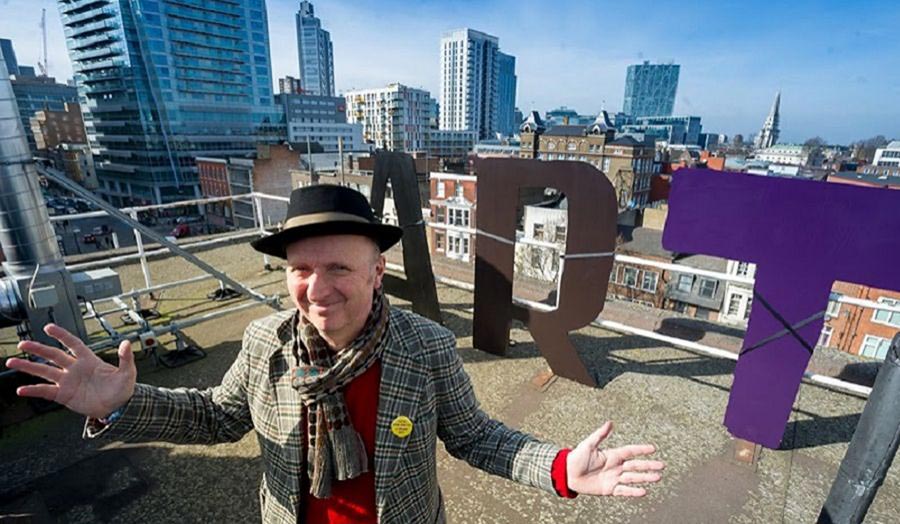 Bob and Roberta Smith with test letters for the planned ART MAKES PEOPLE POWERFUL installation on Central House Roof 