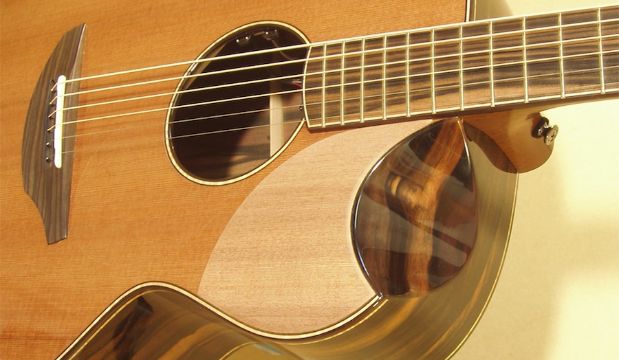 A close up image of a hand made guitar.