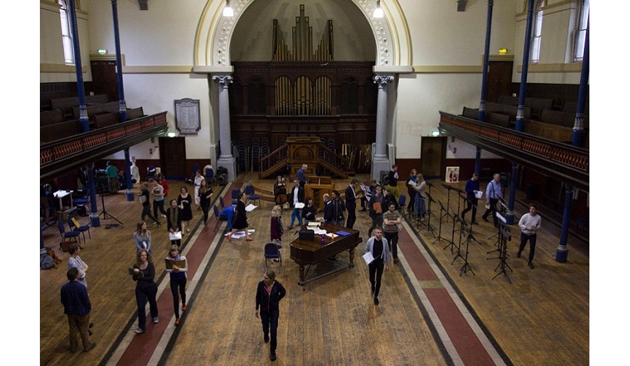 musarc in a church having a sing song